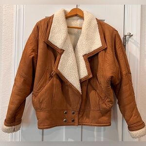 Beautiful nubuck leather jacket/coat with thick fleece lining. Size small.